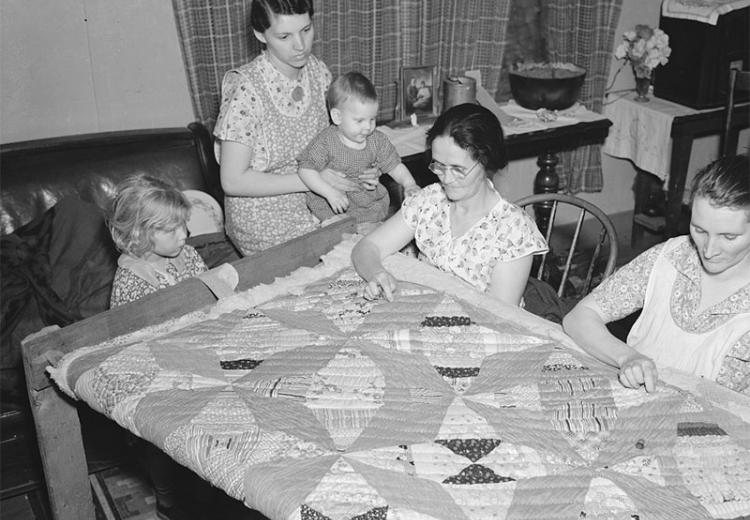 A quilting party in an Alvin, Wisconsin home.